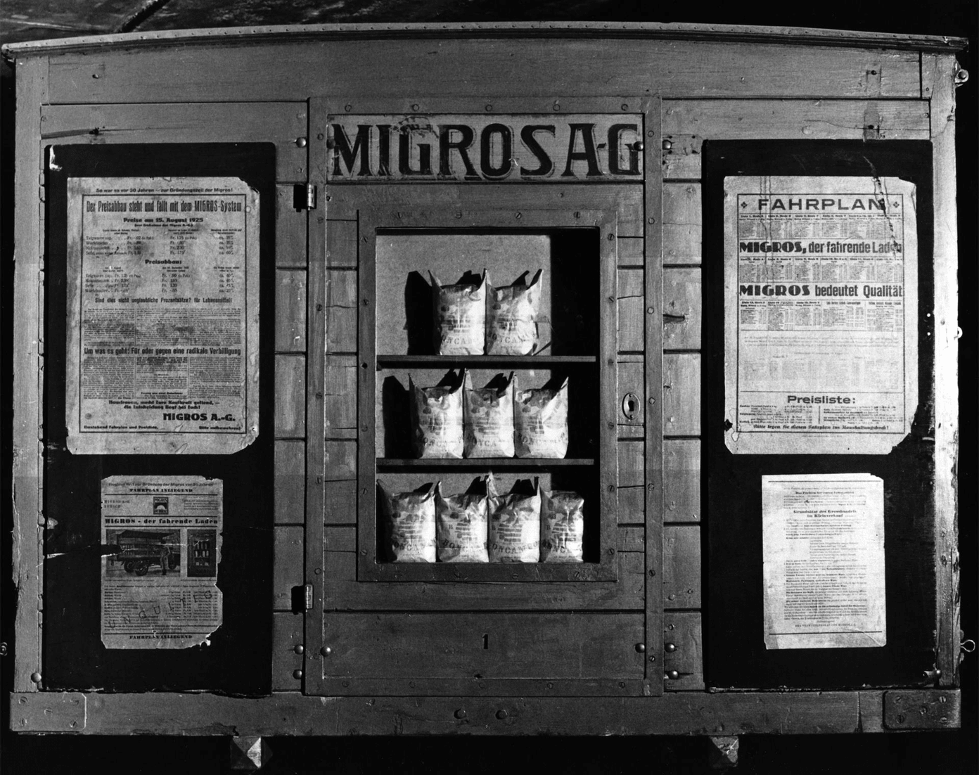 Rear wall of a sales car with timetable and price list (1925)