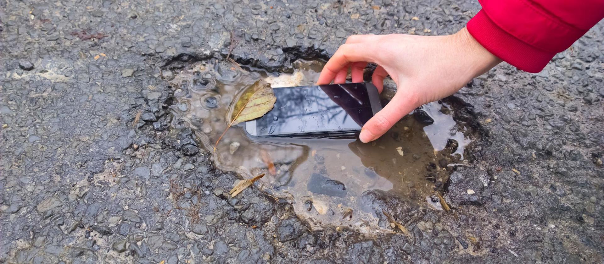 Cell phone in puddle