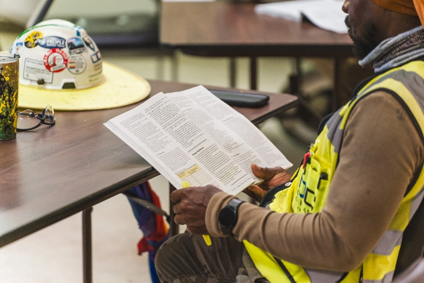construction worker reading fundamentals book