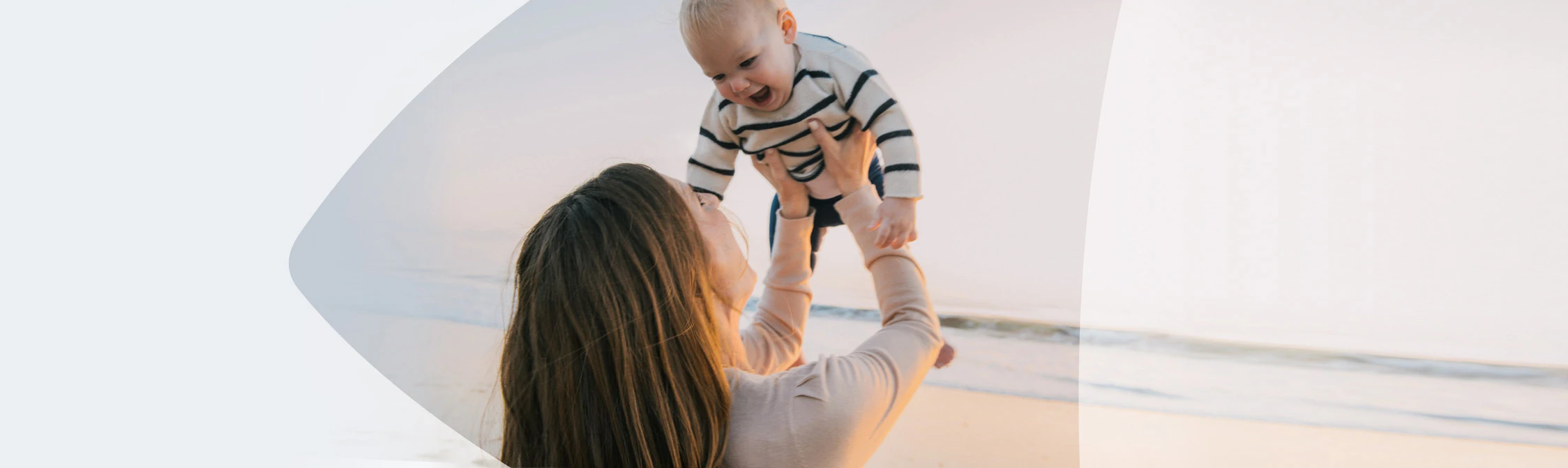 Woman with baby at the beach
