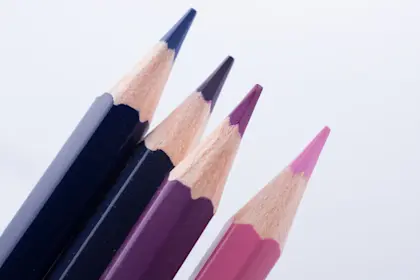 Close-Up Of Colored Pencils Against White Background