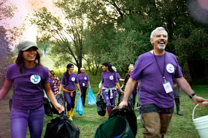 People volunteering to clean up garbage in the park