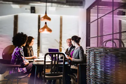 Group sitting in a restaurant and having a meeting