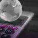 virtual image of a globe resting on a calculator