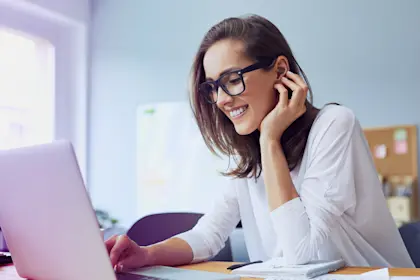 young business woman working on laptop in home office
