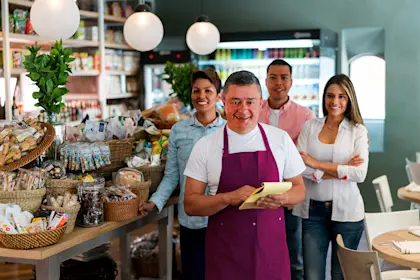 man working at the supermarket with his team 