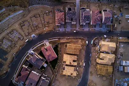 aerial view of suburban homes under construction 