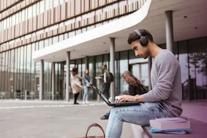 Man with headphones on computer