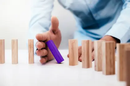 dominos falling on table