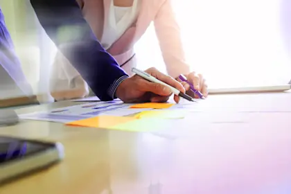Close up of people working at a table