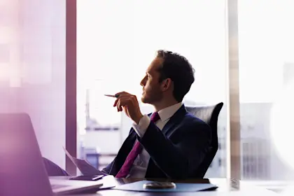 businessman in office looking away 