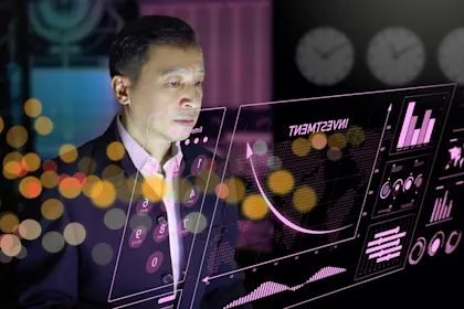 Man looks at investment graph on transparent screen.