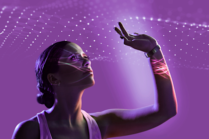 Virtual presentation of woman reaching up to touch waves of tiny light beams