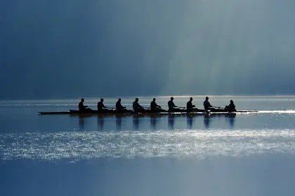 Rowing team on a lake