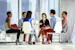 Creative business people meeting in circle of chairs