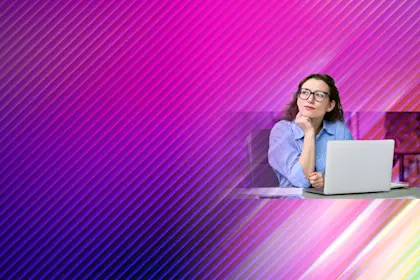 Woman wearing glasses and blue striped shirt thinking while working on laptop against vibrant pink and purple gradient background.