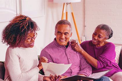 woman assisting couple with taxes