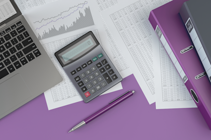 Purple Desk with calculator and pen