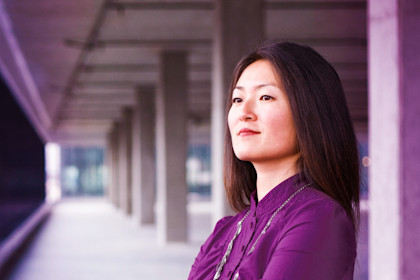 An Asian female business owner in an empty business space