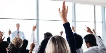 Woman raises hand