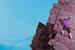 Rock climber scales rock formation.