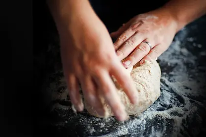 Hand kneading bread dough