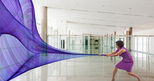 businesswoman pulling purple data waves