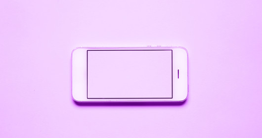 close up of purple phone against purple background