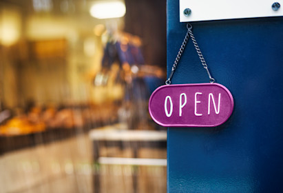close-up-of-open-sign-on-glass-door-to-a-bakery