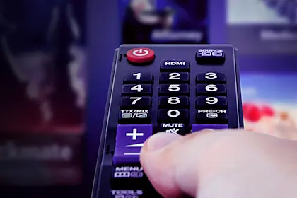 television remote control in hand
