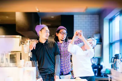Portrait of young employees working at coffee shop