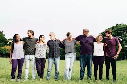 Group of people arm in arm