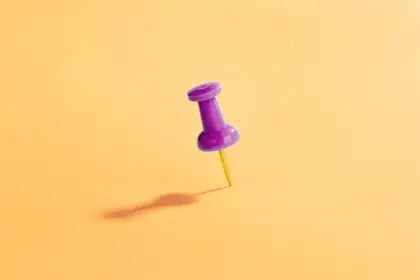 Thumbtack on yellow background