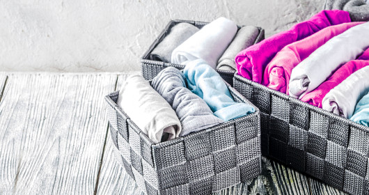 clothes neatly folded in baskets
