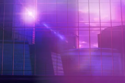 Large office building in front of a panoramic glass window