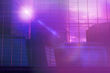 Large office building in front of a panoramic glass window