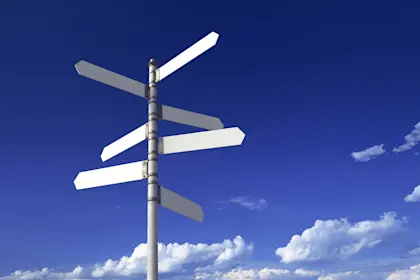 Blank signposts pointing in multiple directions