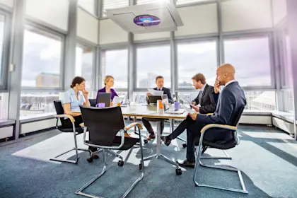Business colleagues having meeting in conference room in modern office
