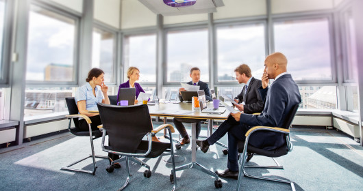 Business colleagues having meeting in conference room in modern office