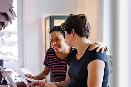 two women working on the computer