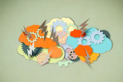 paper cutouts of clouds, lightning, and gears, brainstorming