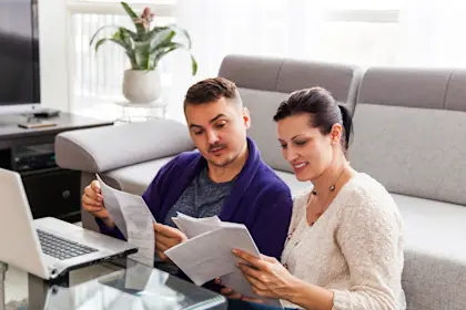 Man and woman looking over paperwork