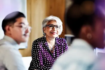 Mature woman smiling during a meeting