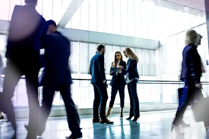 People chatting in a hallway