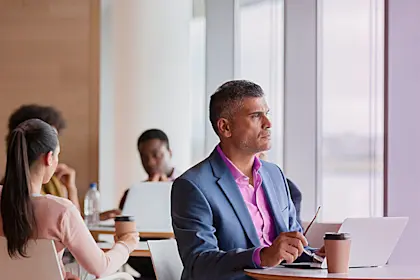 Man sitting in airport lounge with his laptop