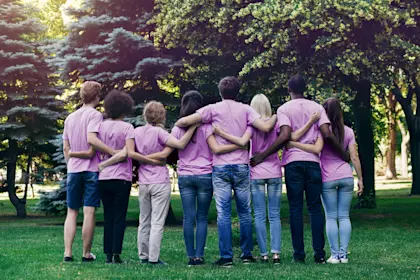 volunteers embracing in a park