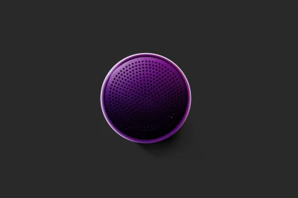 purple bluetooth speaker on gray surface