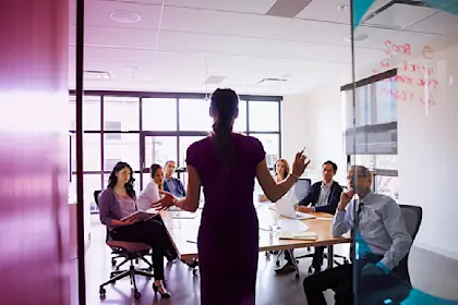 Woman presenting to a room of people