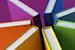 Books of multiple colors lined up to form a star pattern