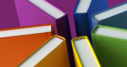 Books of multiple colors lined up to form a star pattern